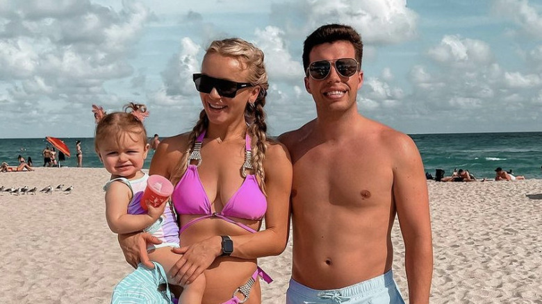 Jovi and Yara on the beach with their daughter