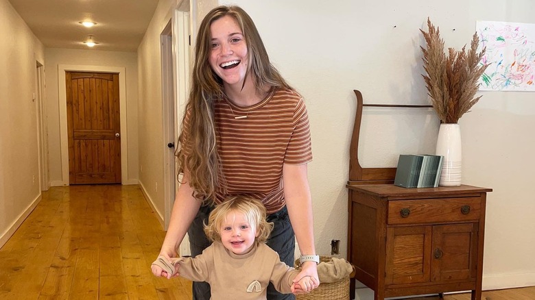 Joy-Anna Duggar and her daughter posing 