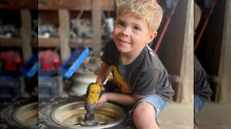 Gideon Forsyth using drill on tire