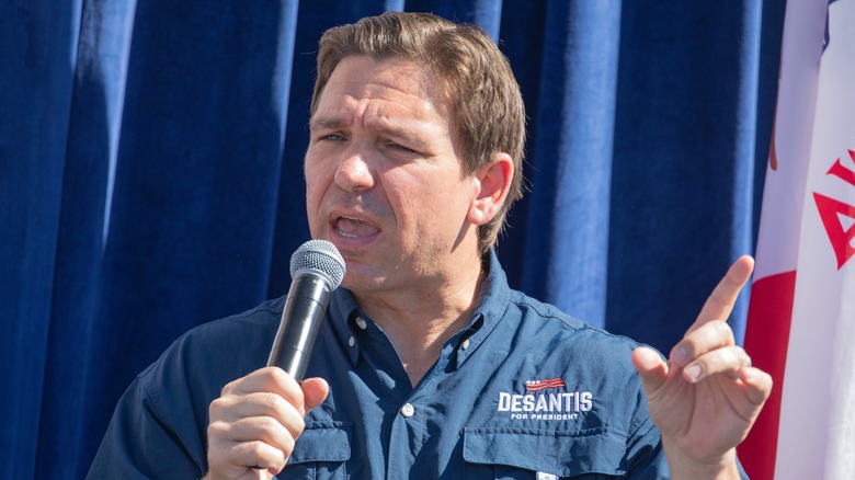 Ron DeSantis speaking into a microphone