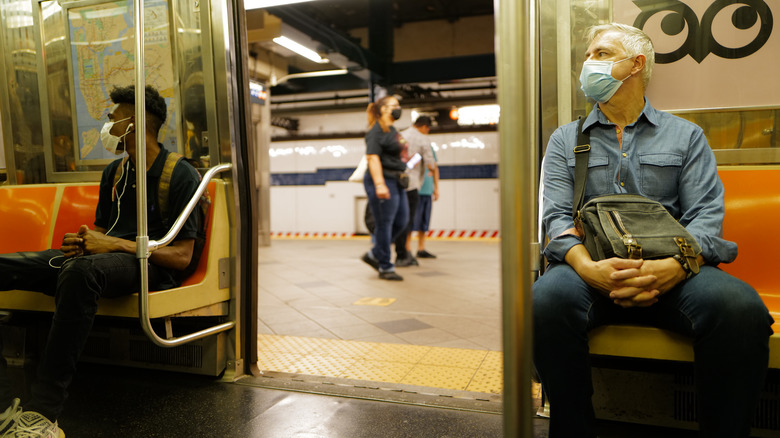 New Yorkers wearing face masks in subway