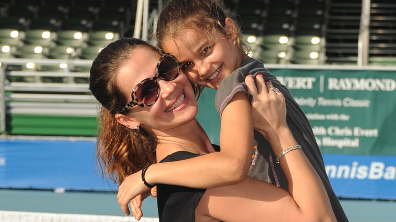 Julia Lemigova holding her daughter Emma