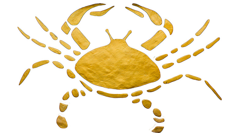 Gold Cancer crab on white background