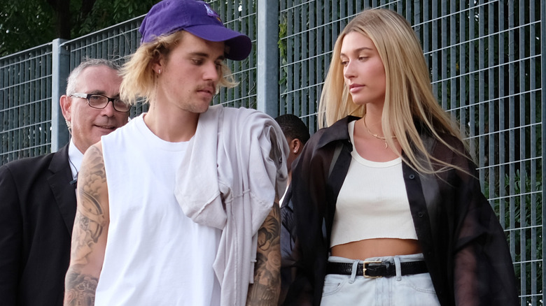 Justin Bieber and Hailey Bieber walking down the street