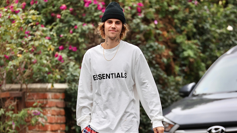 Justin Bieber in sweatshirt and beanie 