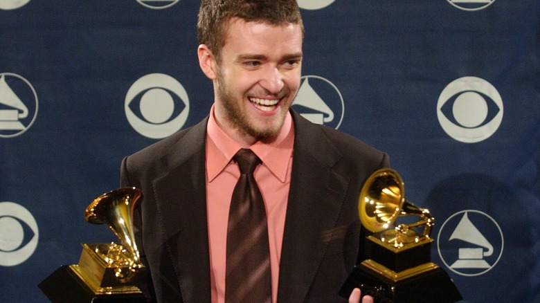 Justin Timberlake holding his Grammys