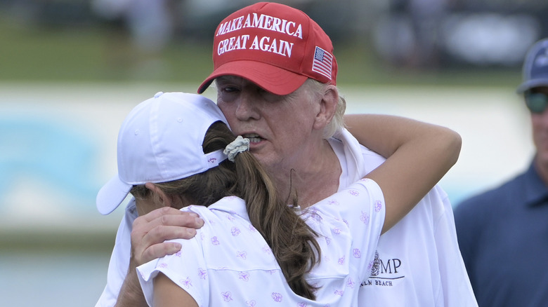 Donald and Kai Trump golfing