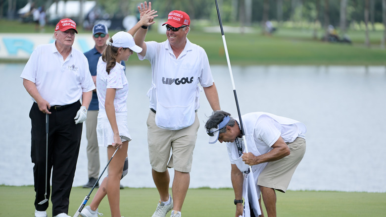 Kai Trump on the golf course with Donald Trump