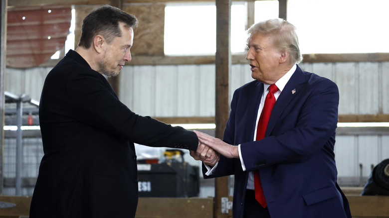 Elon Musk and Donald Trump shaking hands