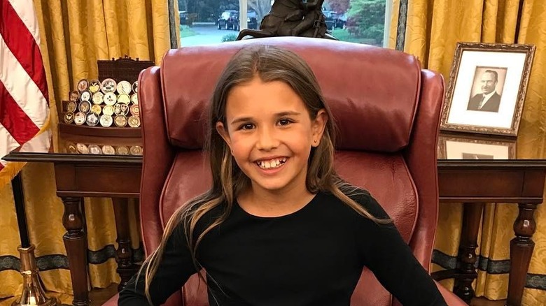 Kai Trump sitting in the president's chair at the White House