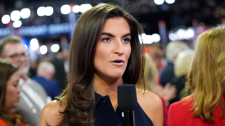 Kaitlan Collins speaking into a microphone