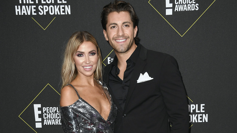 Kaitlyn Bristowe and Jason Tartick posing on red carpet