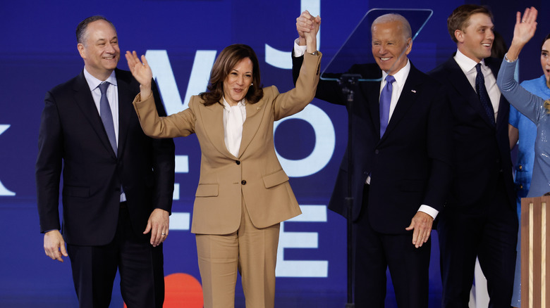 Doug Emhoff, Kamala Harris, and Joe Biden onstage