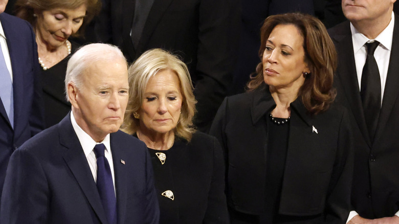 Joe Biden, Jill Biden, and Kamala Harris frowning at Jimmy Carter's funeral