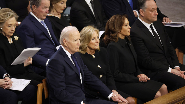 Joe Biden, Jill Biden, and Kamala Harris sitting together at Jimmy Carter's funeral