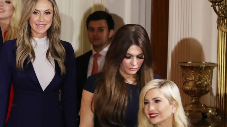 Kimberly Guilfoyle with her head down on election night, surrounded by Ivanka Trump and Lara Trump (2025)