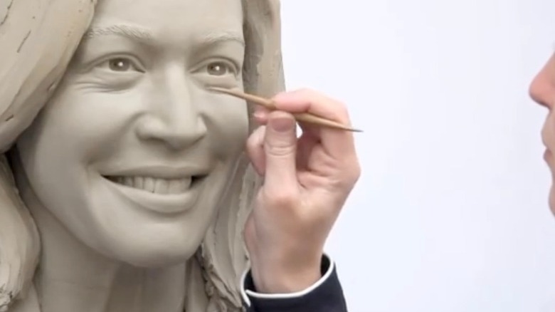 Madame Tussaud sculptor and Kamala Harris clay head