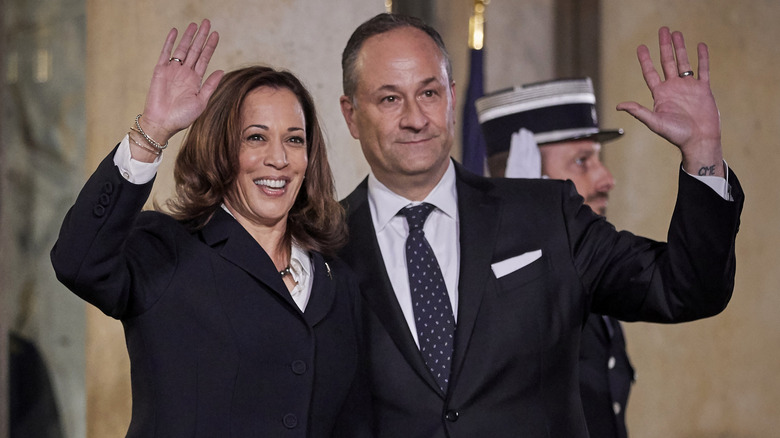 Kamala Harris and Doug Emhoff waving at an event in Paris in November 2021