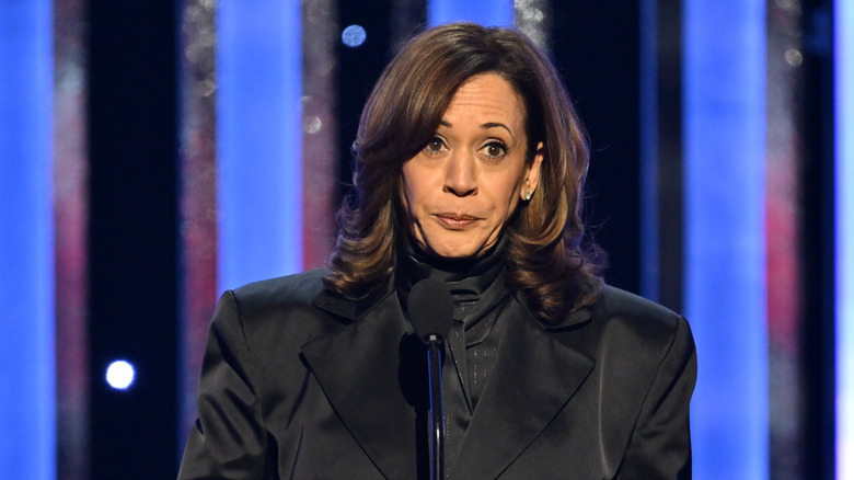 Kamala Harris standing behind a podium at an event