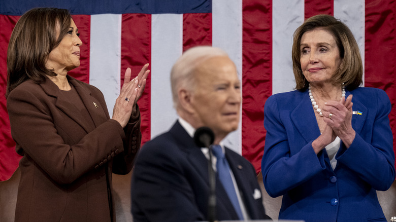 Kamala Harris and Nancy Pelosi applauding behind Joe Biden