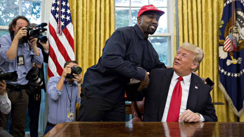 Kanye West and Donald Trump shaking hands