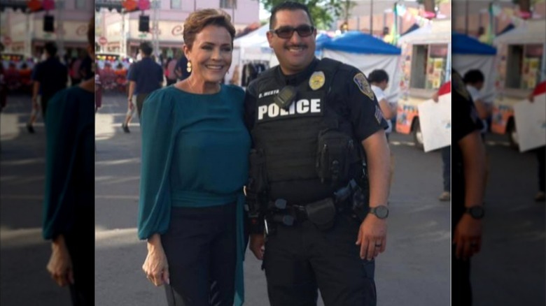 Kari Lake poses next to a police officer for an Instagram post (2024)