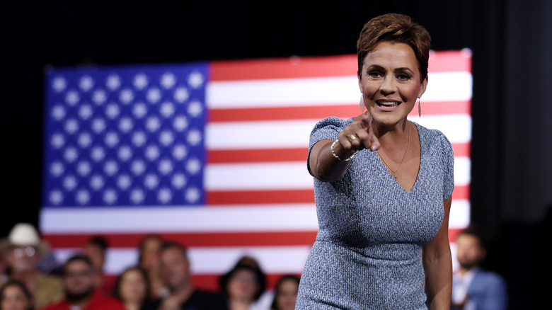 Kari Lake campaigning in front of US flag