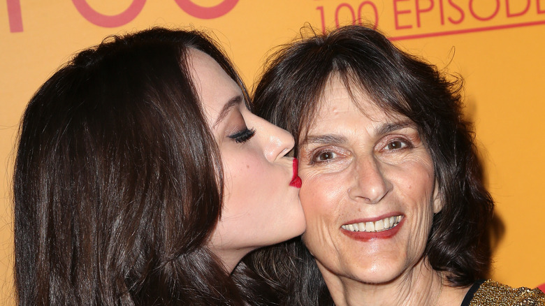 Kat Dennings kissing her mother's cheek