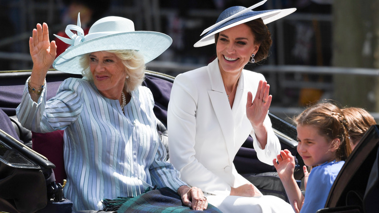 Kate Middleton and Camilla Parker Bowles waving at the Platinum Jubilee parade