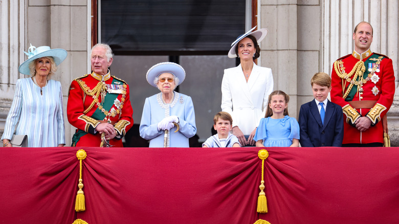 Member of the royal family standing on the balcony of Buckingham Palace