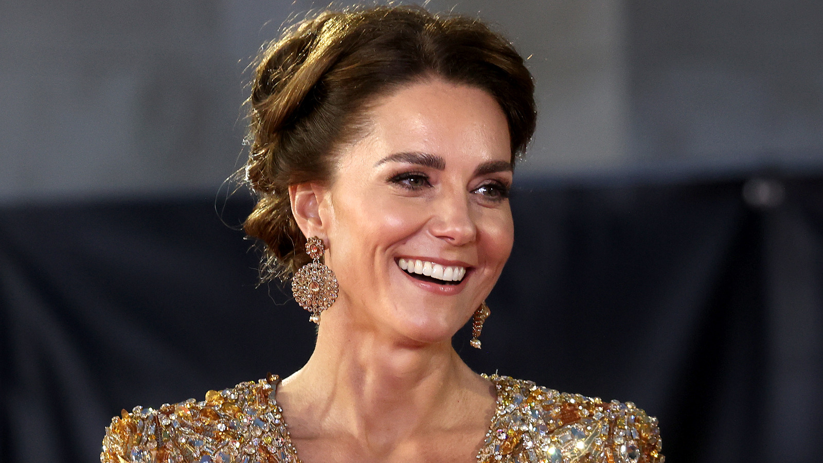 Kate Middleton has stepped out in a custom yellow lace dress from Jenny  Packham during her German tour