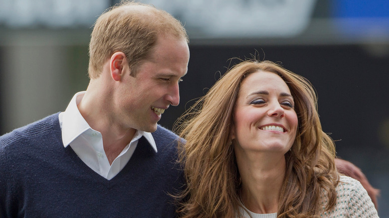 Prince William and Kate Middleton smiling.