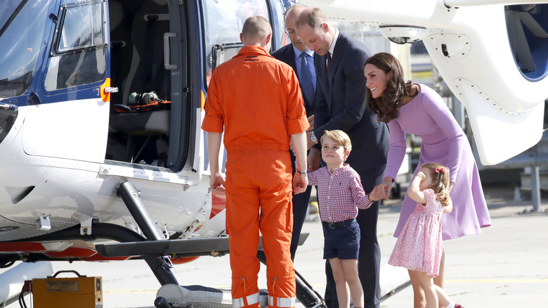 Kate and William with kids near helicopter