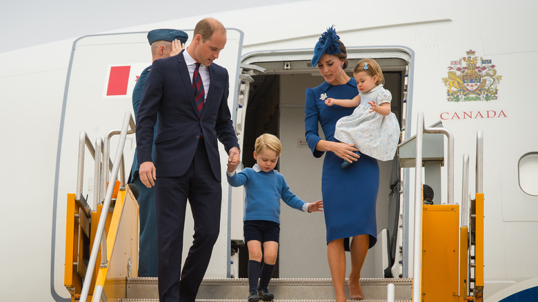 Duke and Duchess of Cambridge with Prince George and Princess Charlotte deboarding plane