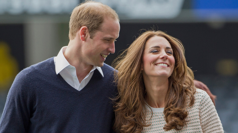 Prince William makes Kate Middleton laugh during a walk