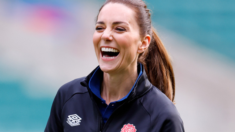 Kate Middleton poses at a rugby event