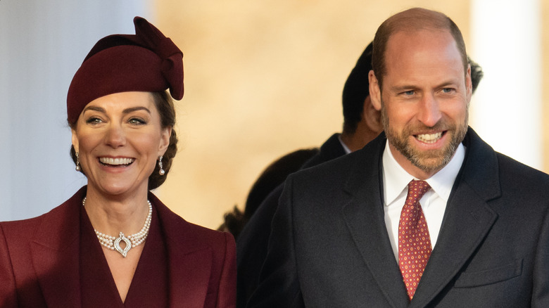 Catherine, Princess of Wales and William, Prince of Wales smile standing side by side