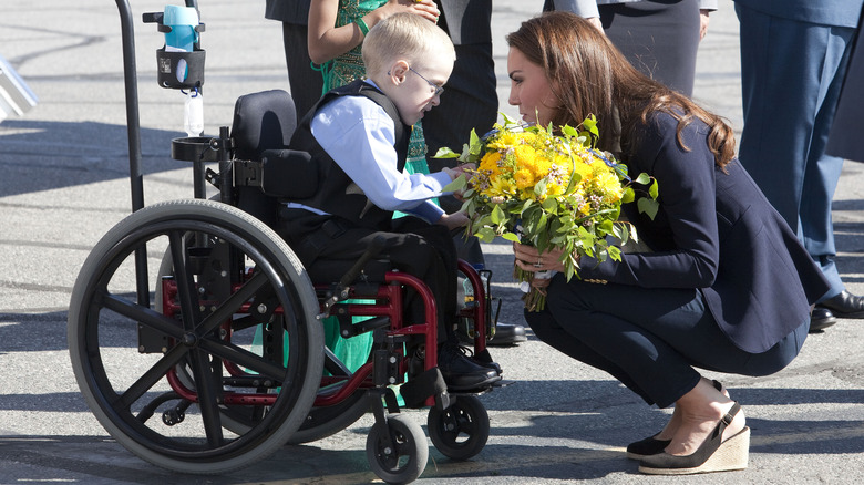 Kate Middleton with boy in wheelchair