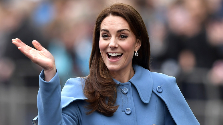 Kate Middleton smiles for photographers