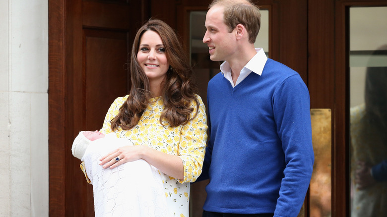 Princess Catherine and Prince William with baby Charlotte on hospital steps