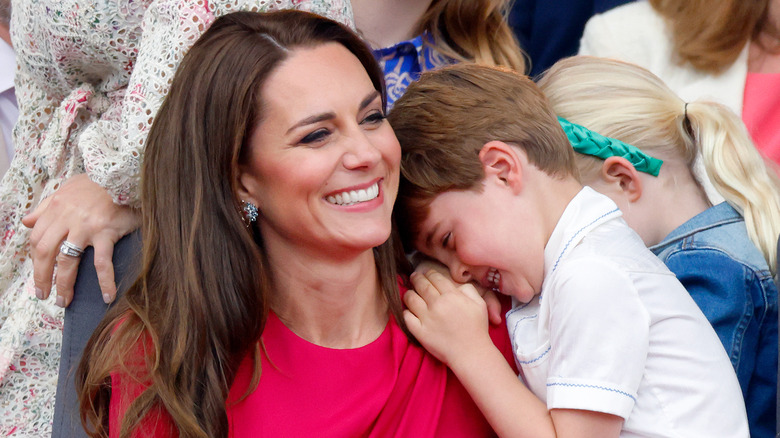 Kate Middleton and Prince Louis embracing