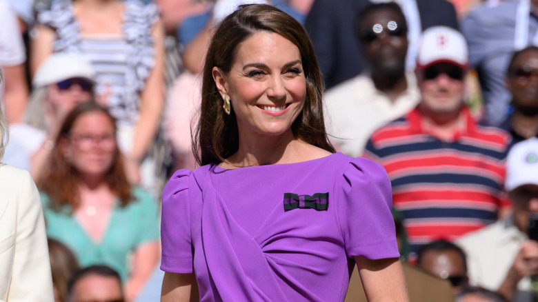 Kate Middleton smiling in front of a crowd