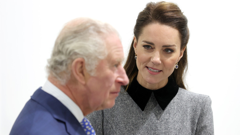 Kate Middleton looking at King Charles III