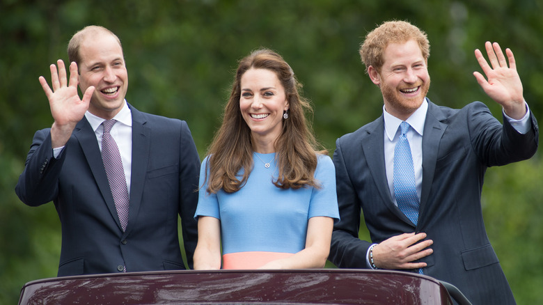 Prince William, Kate Middleton, Prince Harry smiling and waving