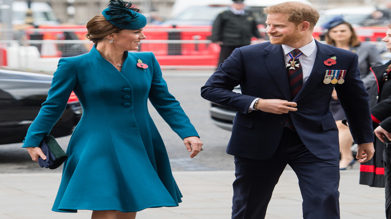 Kate Middleton and Prince Harry at each other