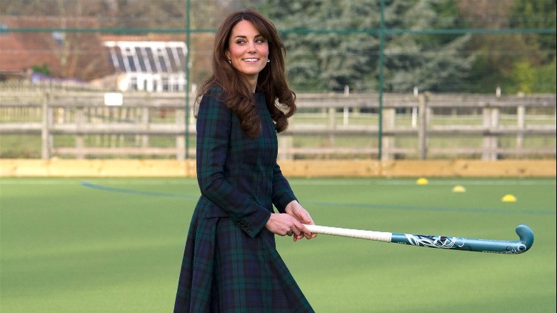 Kate Middleton holding field hockey stick