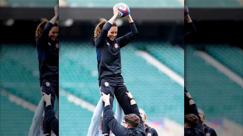 Kate Middleton being lifted catching rugby ball