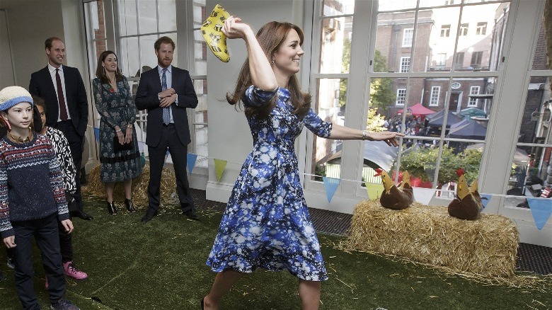 Kate Middleton throws yellow boot