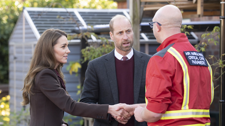 Kate Middleton and Prince William meeting with emergency personnel