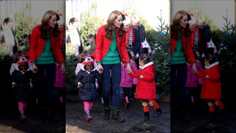 Kate Middleton holding hands with children